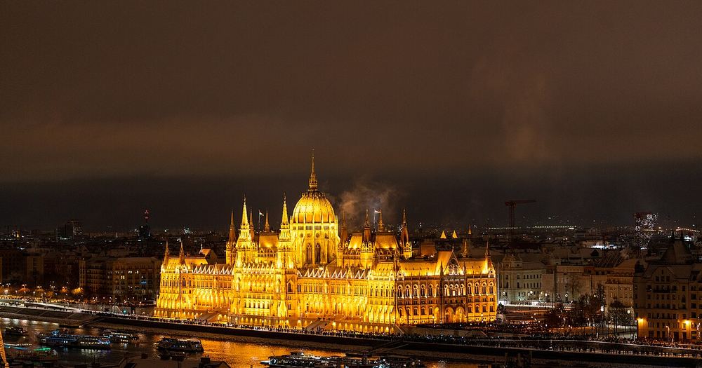 Hungarian Parliament Building over snowy rooftops at night, Budapest (2026)