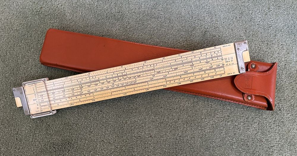 My dad's college slide rule, restored by brother, with new case