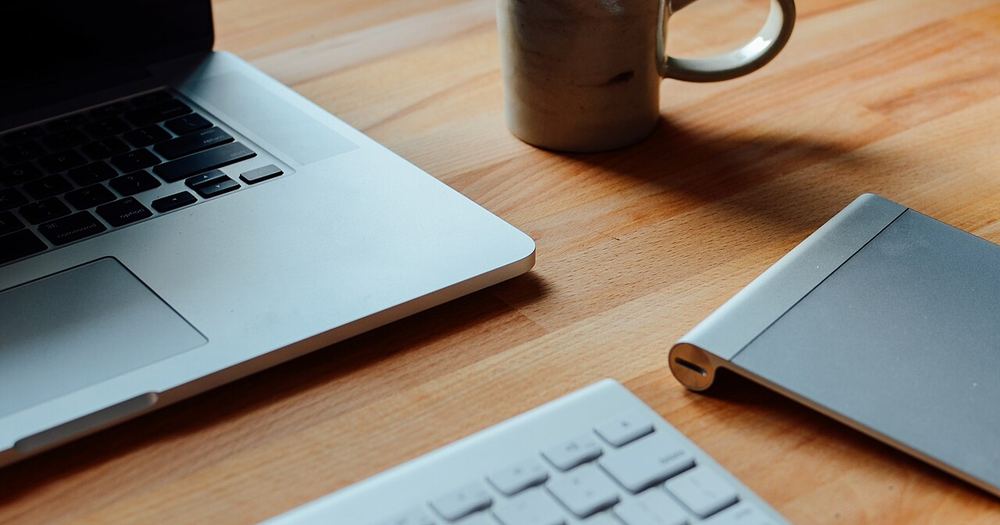 Laptop and a mug (Unsplash)